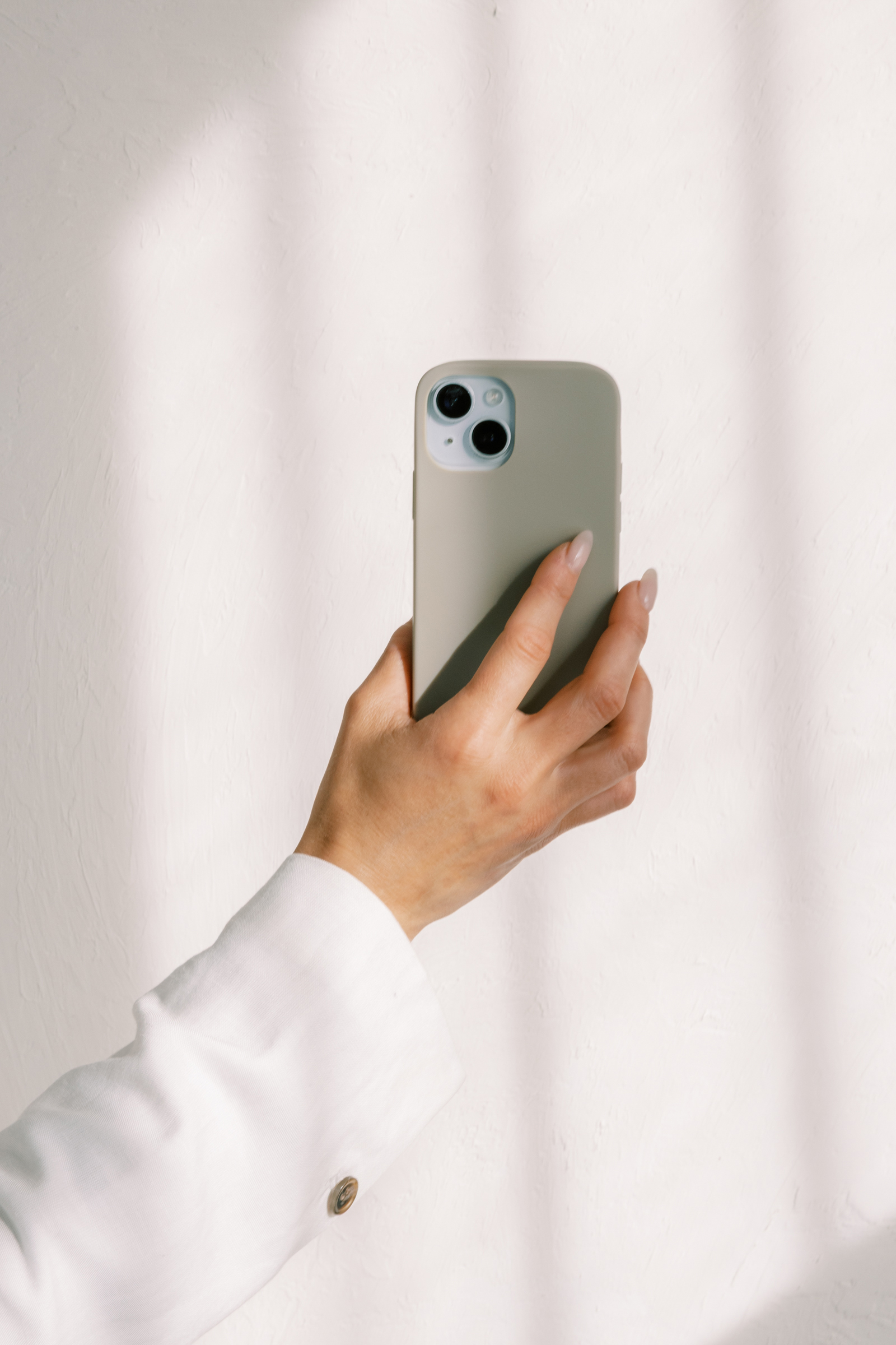 Woman holding cell phone