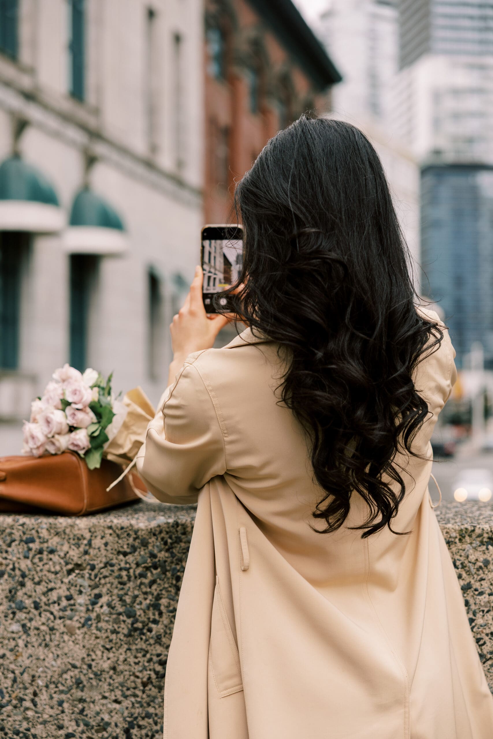 Woman taking photo on phone for Instagram