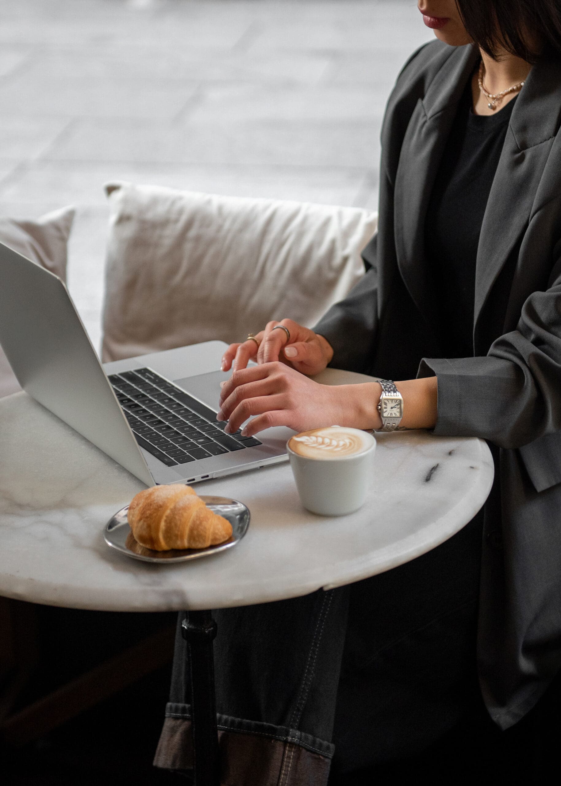 Woman working on her business at cafe.